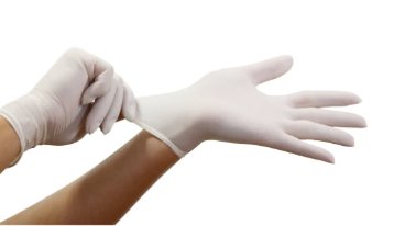 User wearing Diamond 5.5 mil Latex Examination Gloves against a white setting