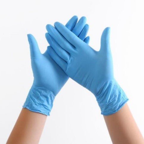 Hands wearing Diamond Blue 3.5 mil Nitrile Exam Gloves